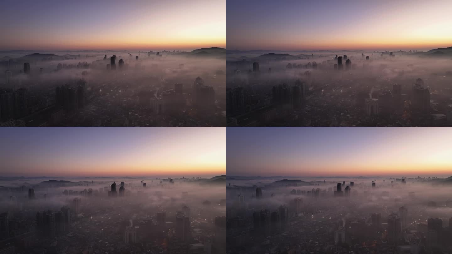 清晨平流雾朝霞中的城市鸟瞰