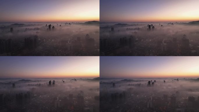 清晨平流雾朝霞中的城市鸟瞰