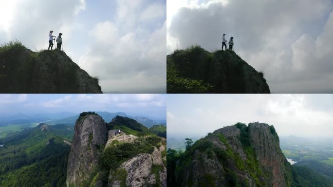 情侣户外旅行登上山顶欢呼皖南山区气势雄伟