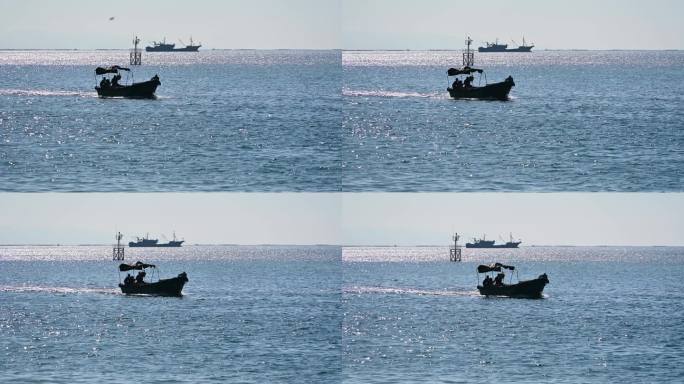 中国海南三亚阳光下海上渔船风光
