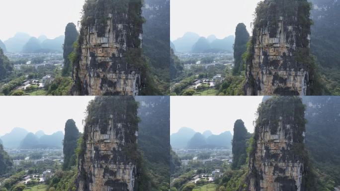 航拍攀登桂林阳朔拇指峰岩壁的结组攀岩者