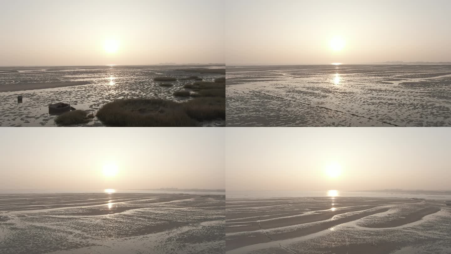 航拍退潮后的海滩日出日落海边阳光滩涂夕阳