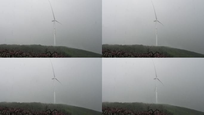 暴雨中的风力发电台旋转中的风轮机