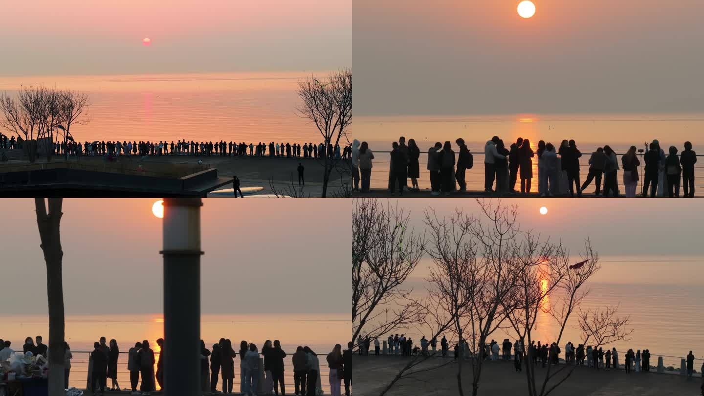 海边看日出的人群