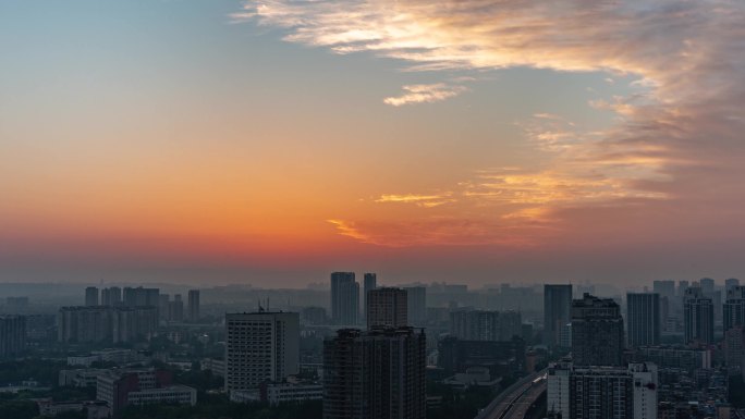 城市天亮建筑剪影城市日出朝霞彩霞天空延时