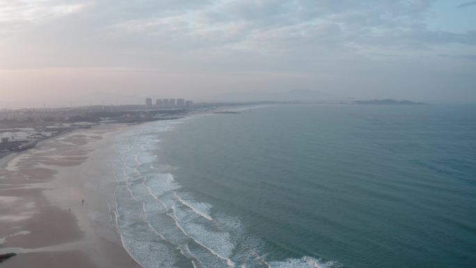 航拍大海俯拍夕阳风车防风林