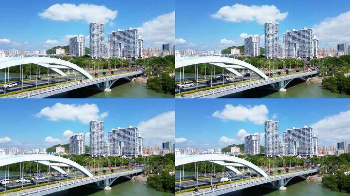 海南省三亚市蓝天白云下的三亚河月川桥