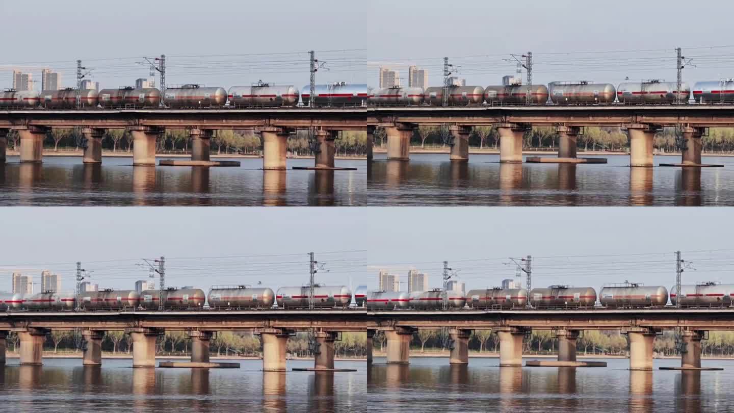 货运火车在河上的铁轨通过