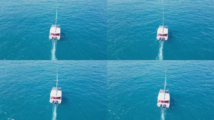 海南三亚高视角航拍西沙海洋蔚蓝色大海帆船