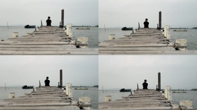 一个人坐在码头看海