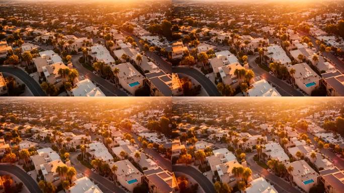 日落时洛杉矶城市景观和棕榈树的鸟瞰图