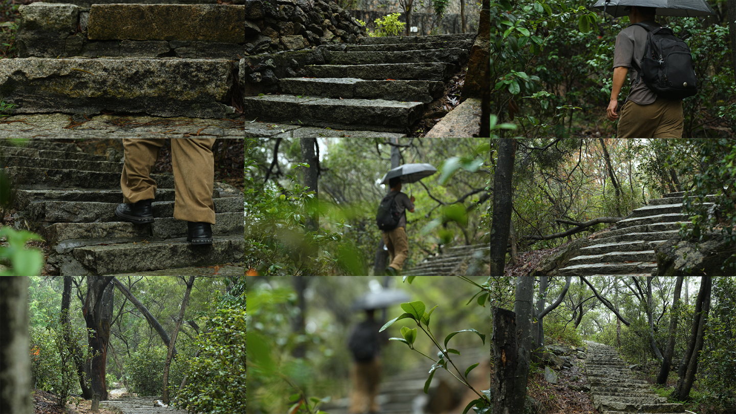 雨天独自一人撑伞走在石阶路上去爬山梅雨