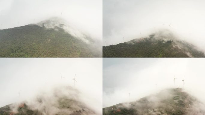海边云雾中的大风车航拍