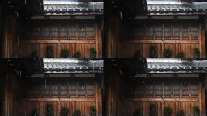 传统中式建筑，雨丝从屋檐滑落