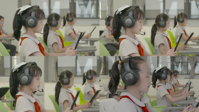 小学生戴耳机平板课互动智慧教室数字校园