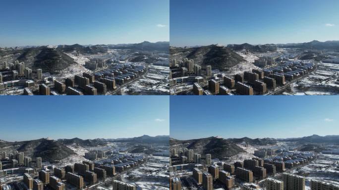 4K济南冬天住房山丘积雪雪景航拍视频