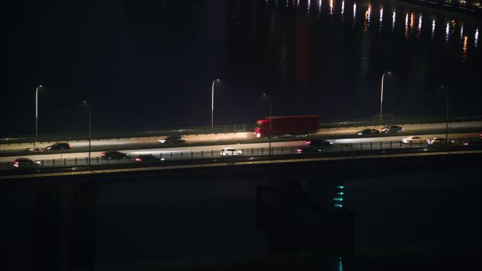 【4K】夜晚城市江面大桥车辆行驶远景