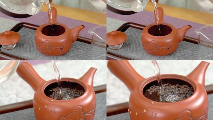 慢动作将热水倒入茶壶中冲泡茶叶