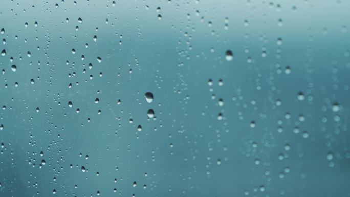 4k下雨雨水飘落在玻璃窗上小清新空镜头