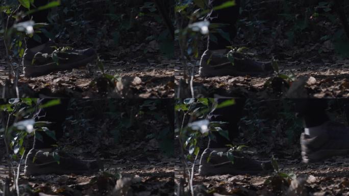 男人攀登山峰丛林山路脚步特写