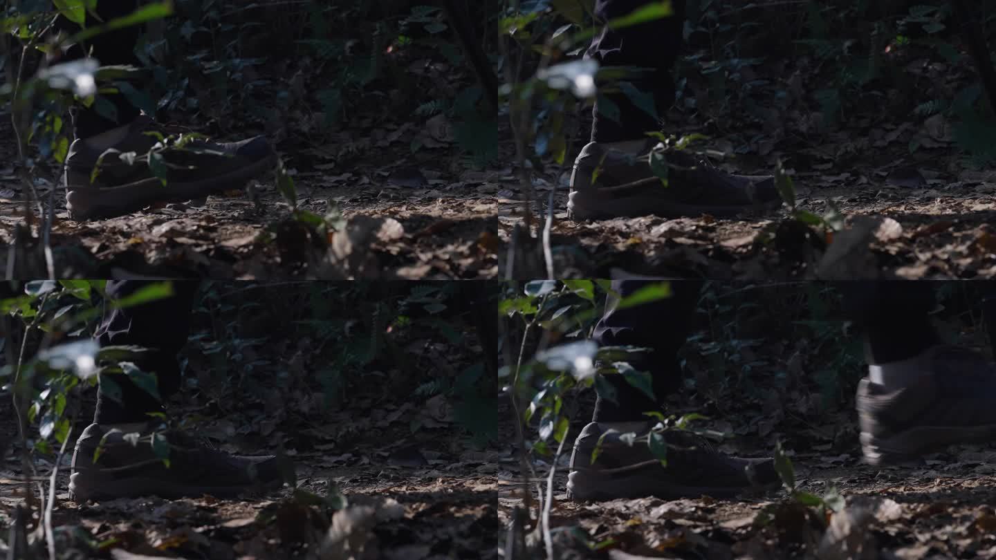 男人攀登山峰丛林山路脚步特写