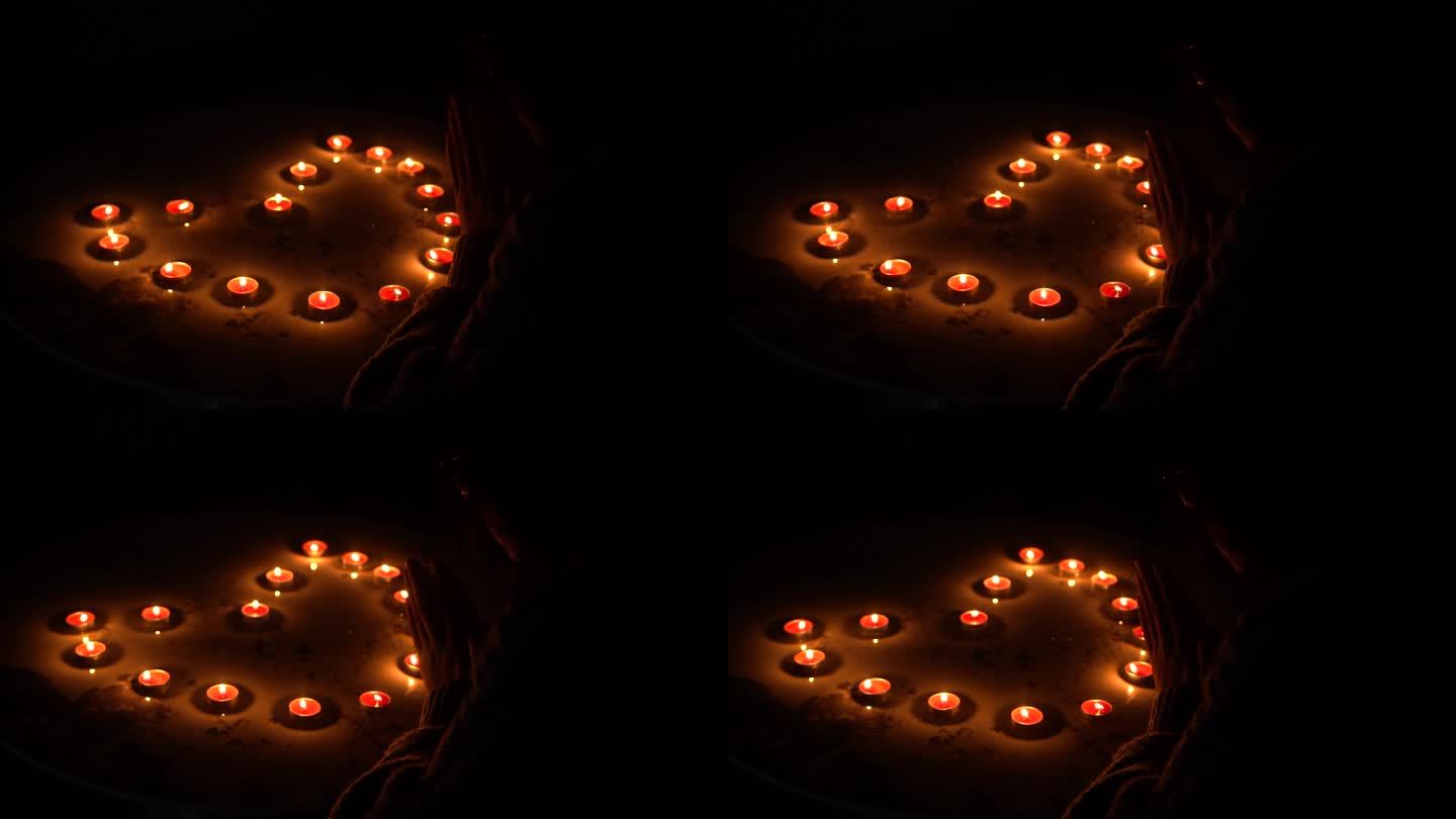 4K情人节氛围对着心形蜡烛许愿剪影实拍