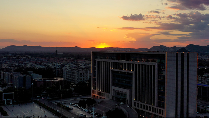 4K航拍唐山古冶区政府大楼夕阳街景