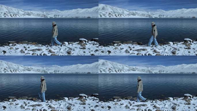 年轻女子从湖边走过徒步旅行雪山湖泊