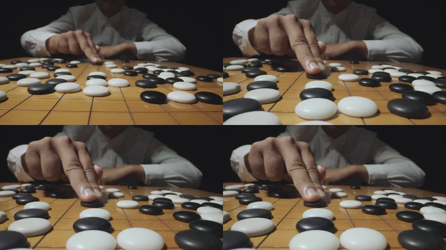 男人下棋围棋棋盘棋子棋局对弈