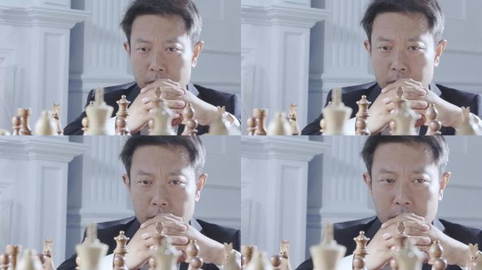 男人面对国际象棋思考对弈棋局