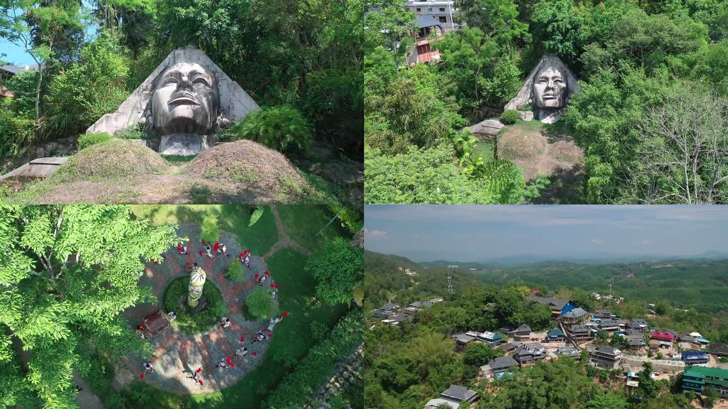 基诺族创世祖的雕像和基诺山寨航拍