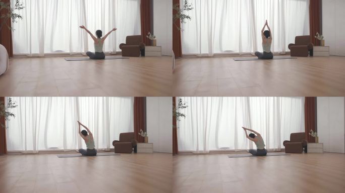女人在客厅室内做瑜伽运动