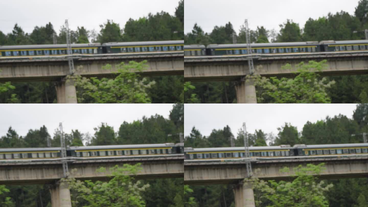 绿皮火车驶过桥梁