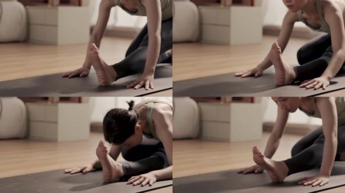 女人做瑜伽运动压腿