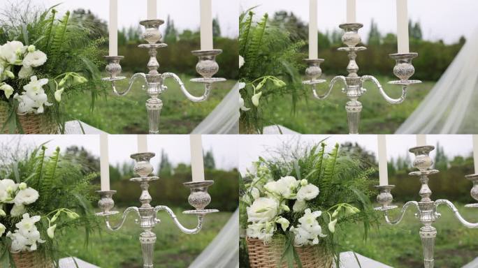 户外婚礼花朵绿植花篮银色烛台白色蜡烛纱幔
