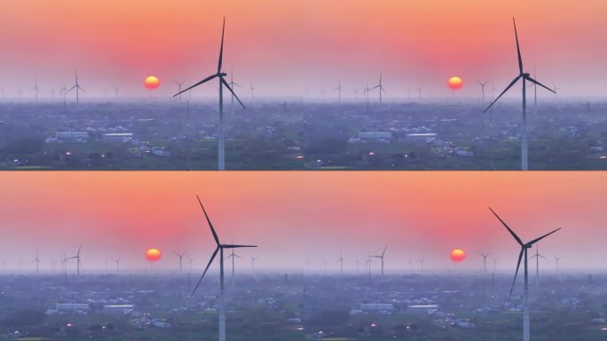 航拍夕阳落日太阳风力发电站群村庄农户平原