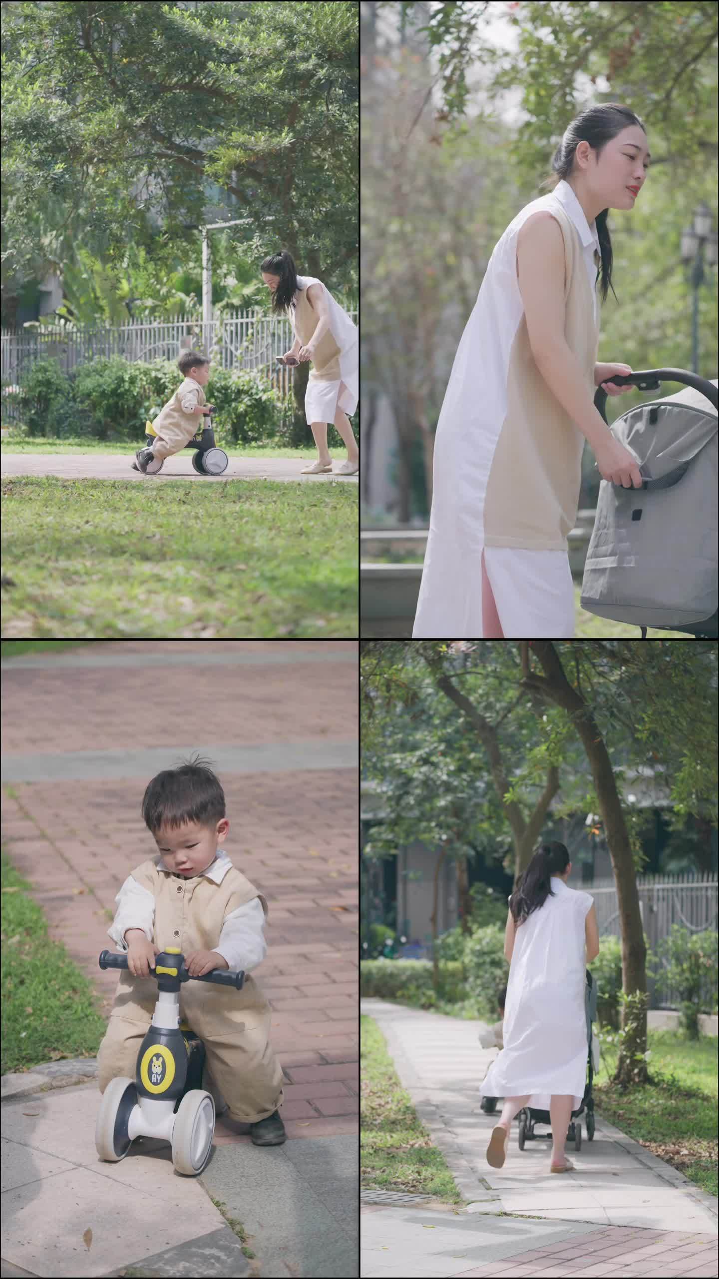 漂亮妈妈带着宝宝在公园里玩