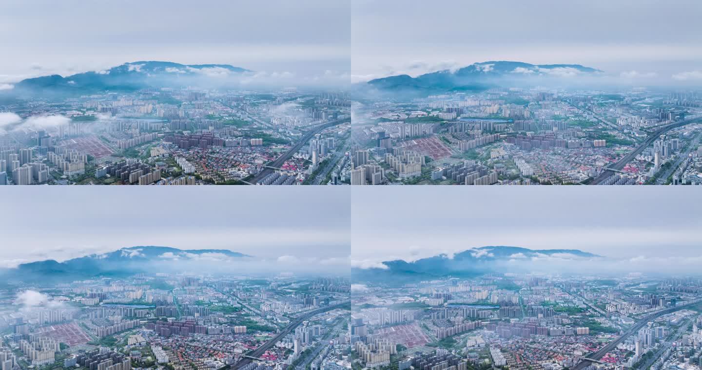 低空云雾下的九江城景航拍延时