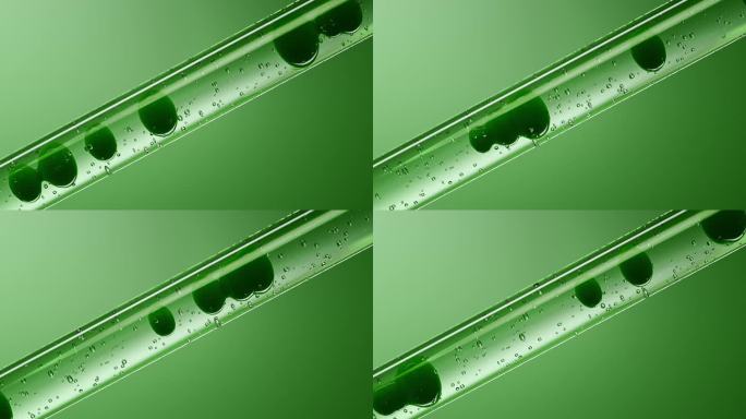 玻璃试管里流动的绿色植物精华液细胞分子