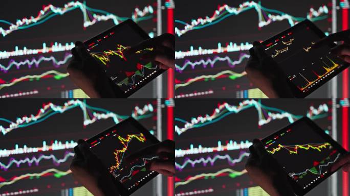在数字平板电脑上分析股票市场图表