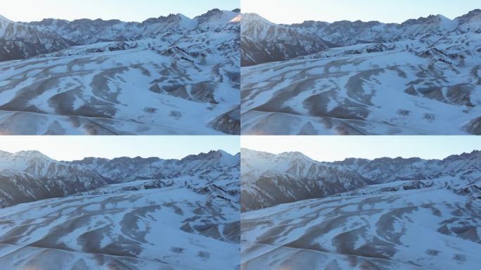 航拍冬季新疆赛里木湖夕阳雪山纹理日照金山