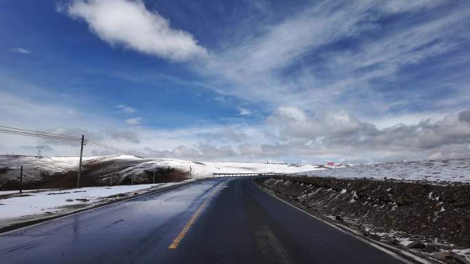 第一视角实拍巴塘 道路雪山 雪花飞舞