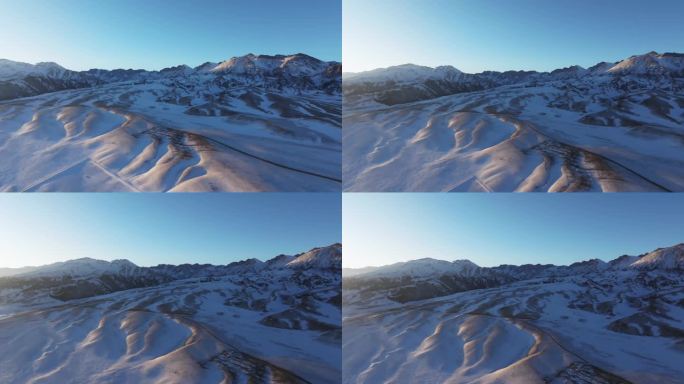 航拍冬季新疆赛里木湖夕阳雪山纹理日照金山