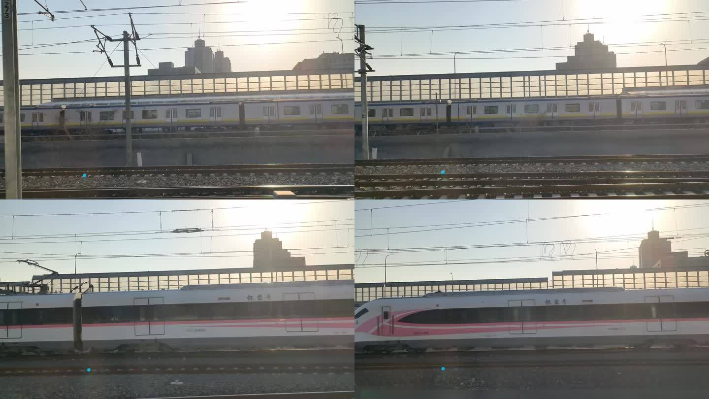 高铁缓缓驶出驶入站台行驶在路上窗外风景