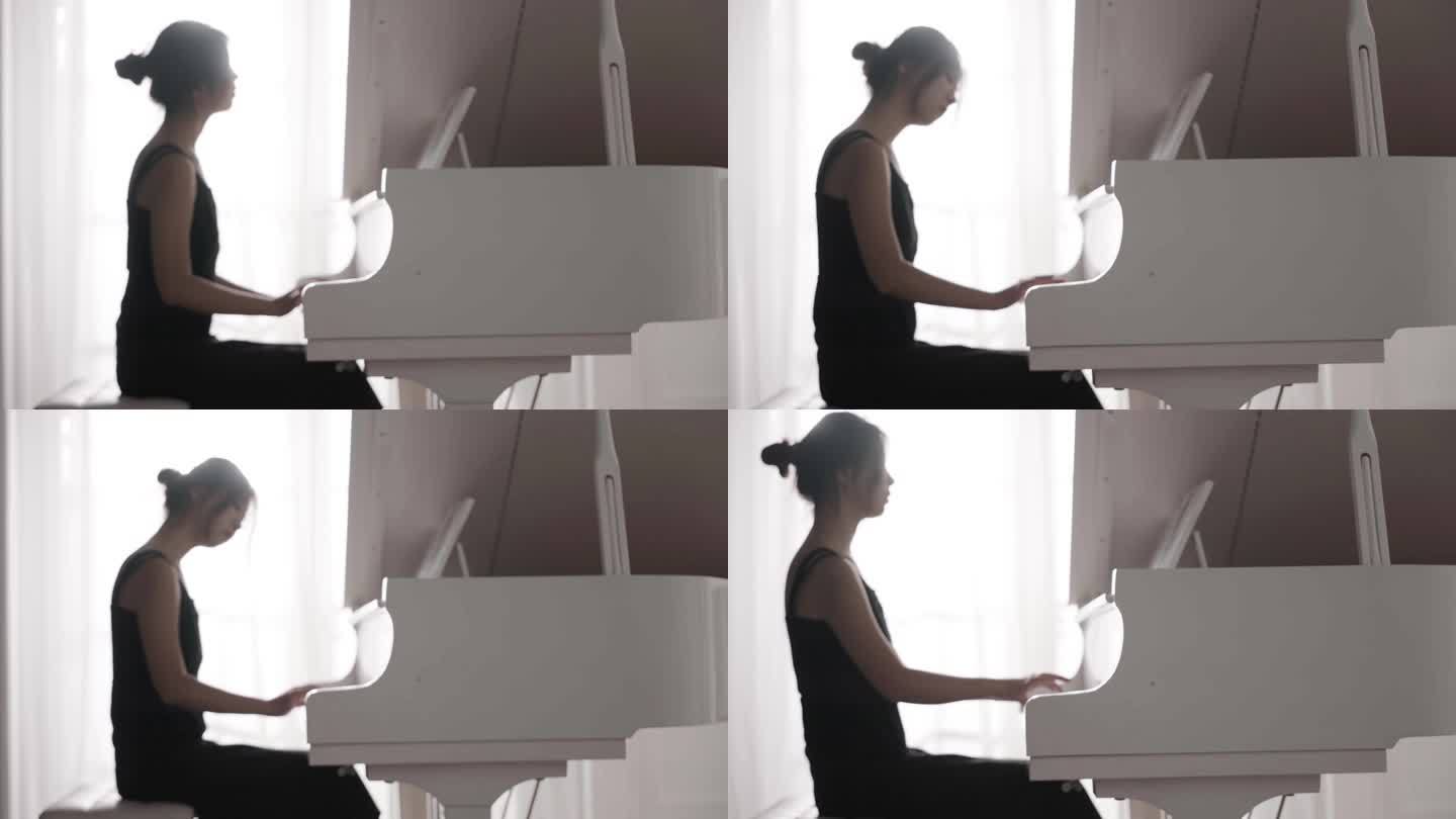 年轻女人弹钢琴
