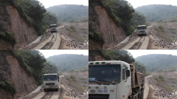 大卡车行驶在泥泞的临时道路上