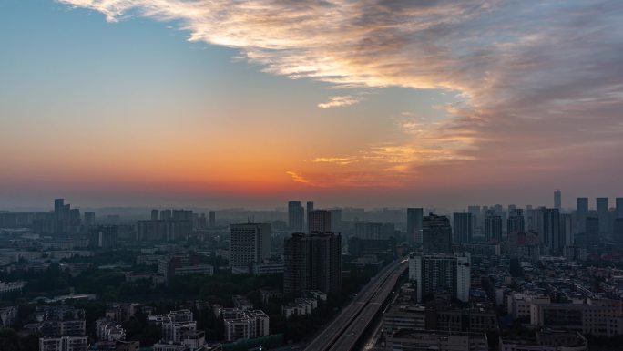 城市天亮建筑剪影城市日出朝霞彩霞天空延时