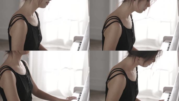 年轻女人弹钢琴