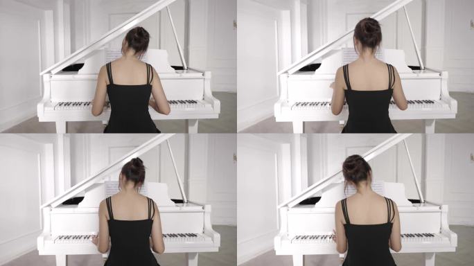 年轻女人在白色房间弹钢琴背影