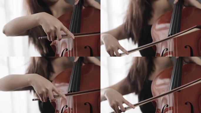 女人演奏大提琴手特写